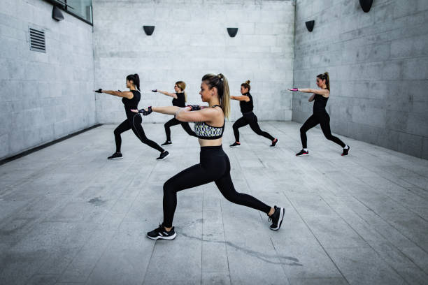 istock Handsome young sportswomen exercises aerobic 1281786427