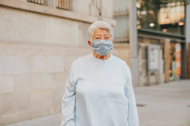 istock Senior woman wearing mask 1281786526