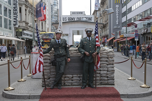 Berlin, Germany - July 13, 2017: Checkpoint Charlie in Berlin, Germany. It was the former border crossing between the West and East Berlin during the Cold War.