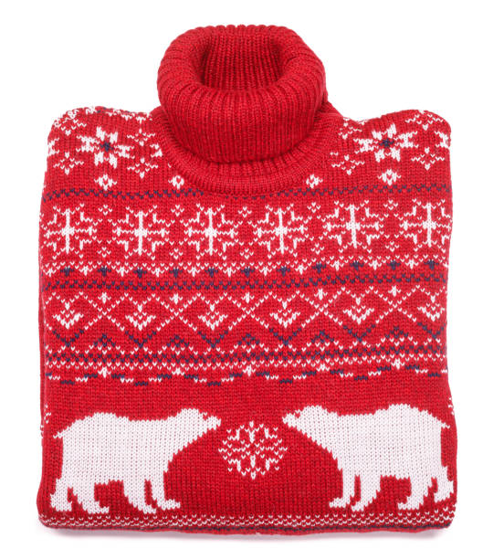 Red knitted Christmas turtleneck sweater with nordic ornament folded on white background