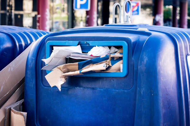 istock Full public paper and cardboard recycling trash container. Waste sorting. 1281788203