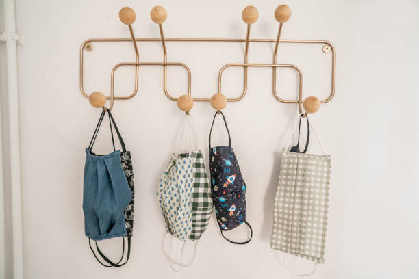 istock Masks hanging on coat Rack 1281788426