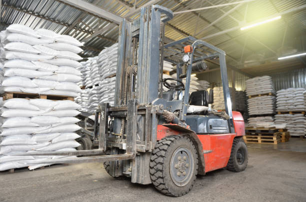 istock A forklift stands in a warehouse next to pallets with full bags 1281789008
