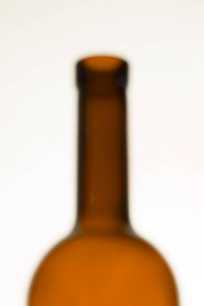 A wine bottle image in lens blur. Lens blur image of an empty bottle silhouette.