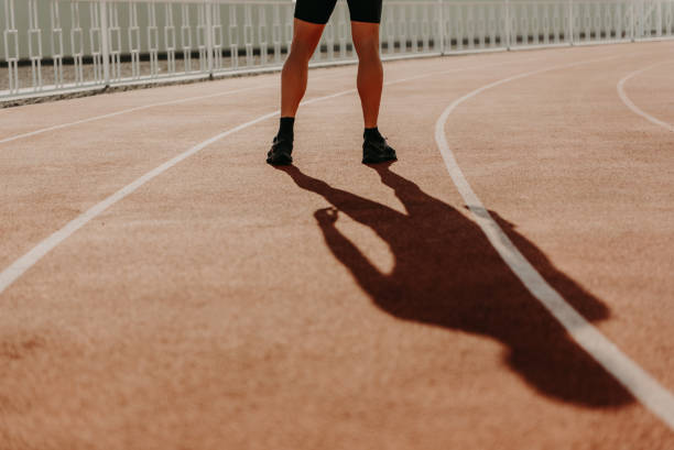 istock Runner feet on track at stadium 1281790839