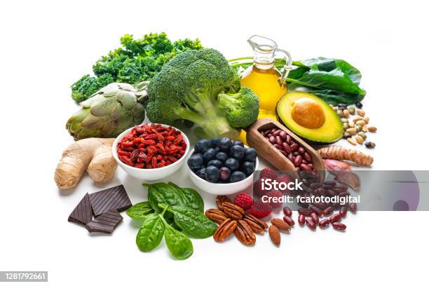 Group Of Vegan Food Rich In Antioxidants On White Background Stock Photo - Download Image Now