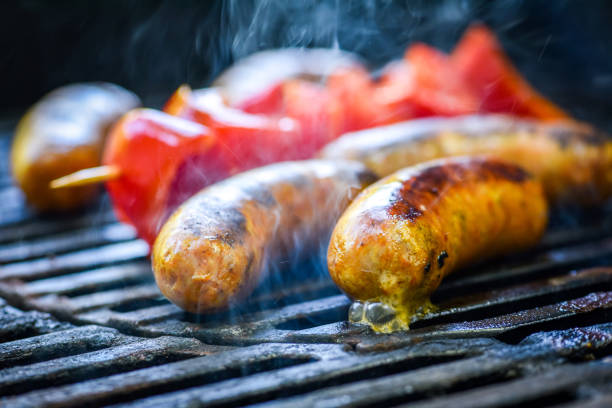 Close up shot of German sausages on barbeque. No people, horizontal color image