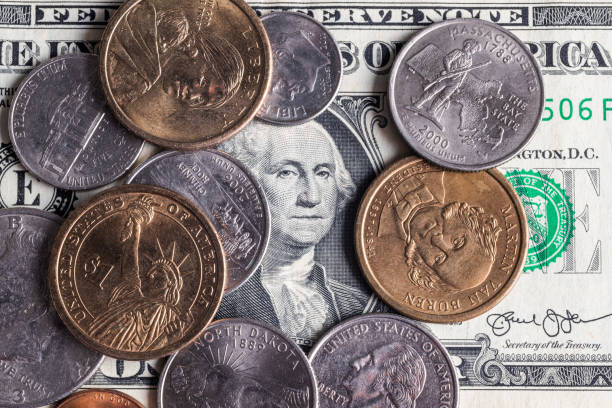 istock American coins and one dollar bill 1281795563