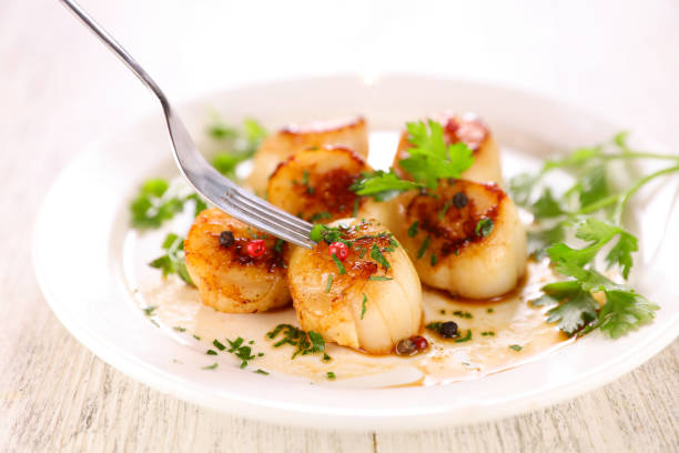 istock seared scallop with herb in plate 1281798479