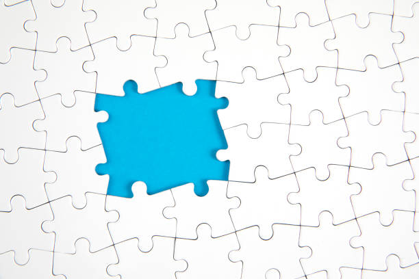 istock Jigsaw Puzzle Pieces on Blue Background 1281799906