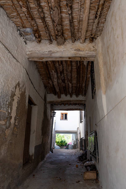 a narrow street in yegen - alpujarra fotografías e imágenes de stock