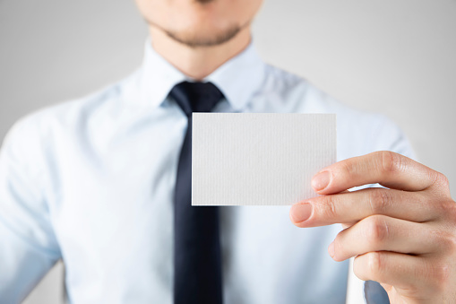 Businessman showing his empty business card