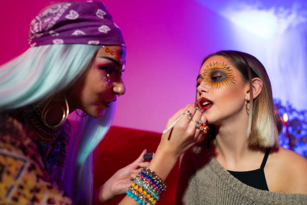 istock Girls applying make-up and getting ready for a Halloween party. 1281802592