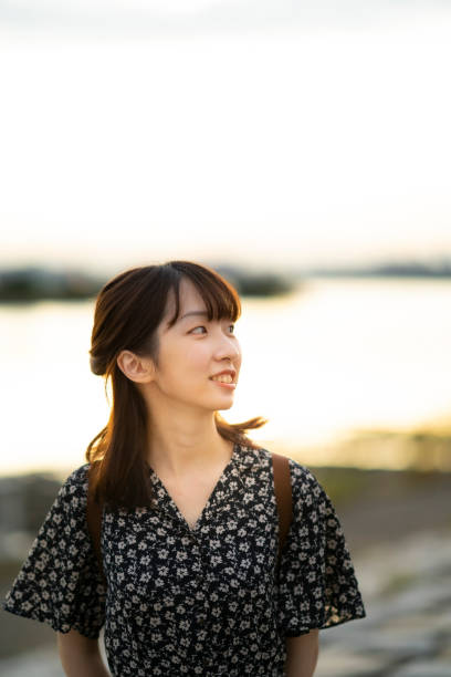 istock asian young woman at the beach 1281804584