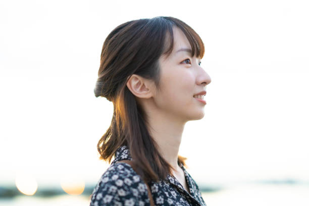 istock asian young woman at the beach 1281804604