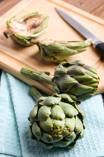 Fresh artichoke on a cutting board