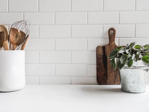 istock Kitchen background with kitchen utensils and houseplant 1281807773