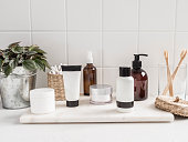 White bath background with cosmetic bottles