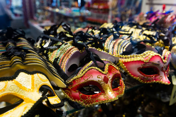istock Traditional venician masks on shelves in shop in Venice 1281811492
