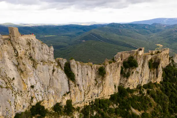 Photo of Ruins of Cathar castle of Peyrepertuse perched on rocky ridge