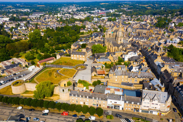 General view of Guingamp with Basilica and fortified chateau, Brittany General view of French town of Guingamp in summer looking out over medieval Basilica and walls of ancient fortified chateau, Brittany guingamp stock pictures, royalty-free photos & images