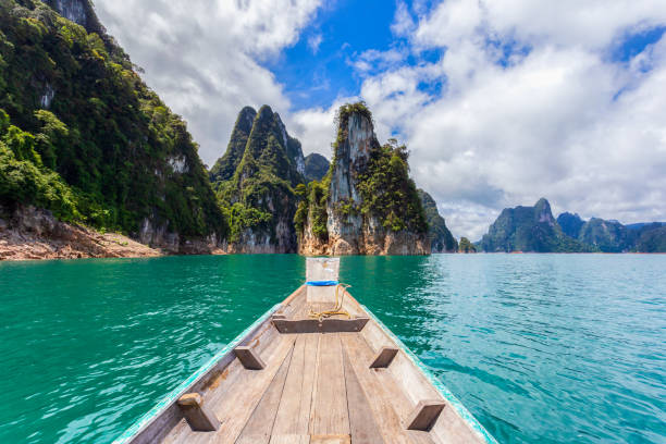 istock Traditional longtail boat with beautiful scenery view in Ratchaprapha Dam at Khao Sok National Park. 1281812001