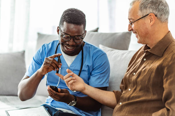 istock Male nurse and patient doing a glucose test 1281812927
