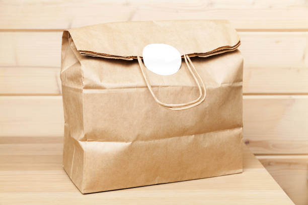 istock Full paper bag with white sticker 1281814653