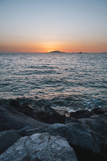 sunset behing ischia island on the sorrento coast in italy - sorrentine peninsula imagens e fotografias de stock