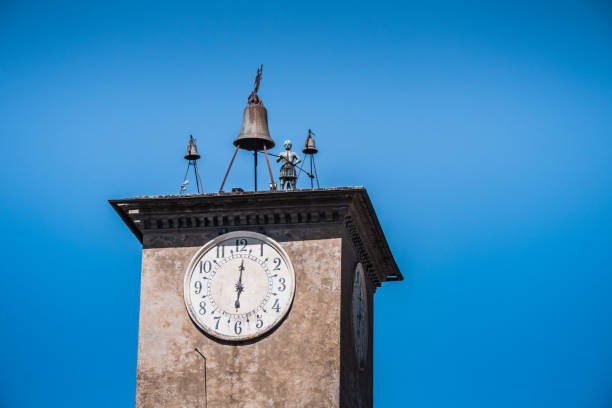 Maurizio's Tower with Bell and Bronze Statue in Orvieto, Italy, a mechanical Clock Tower with Bells and an Automaton