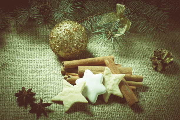 istock Christmas gingerbread cookies on sackcloth with cinnamon and star anis 1281816885