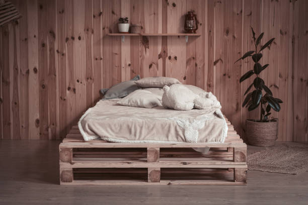 istock Simple cozy bed in wooden apartment. Front view. Comfortable place or space for rest 1281817066