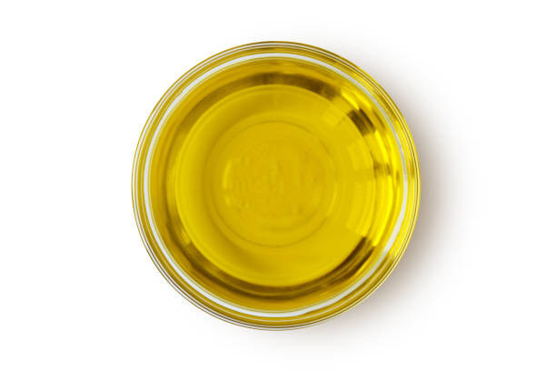 istock Virgin olive oil in glass bowl on white background 1281817920