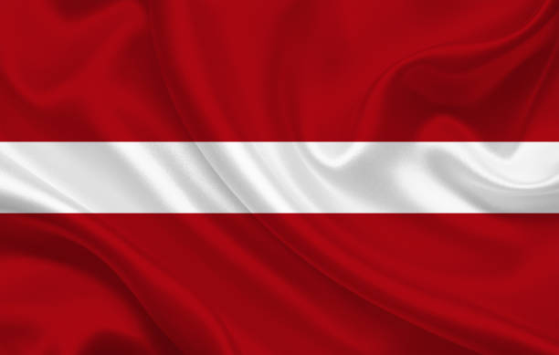istock Flag of latvia country on wavy silk fabric background panorama 1281818278