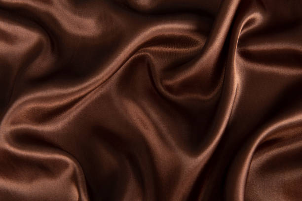 istock Abstract chocolate background, brown abstract satin silk 1281818404