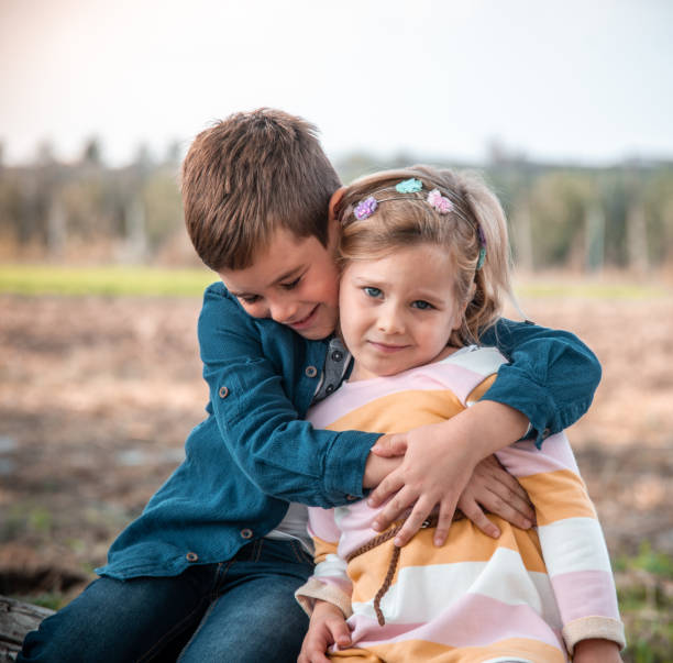 istock Portrait of two children embracing 1281818527