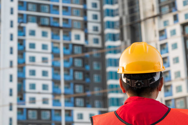 istock A man in a position of engineer wearing a safety helmet is checking work at the construction site 1281819533