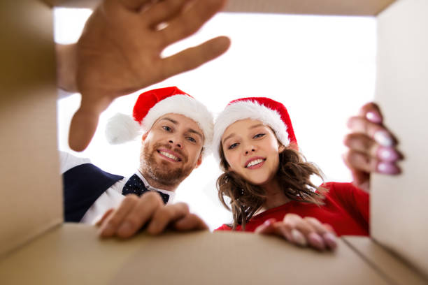 istock happy couple opening christmas gift box 1281819573