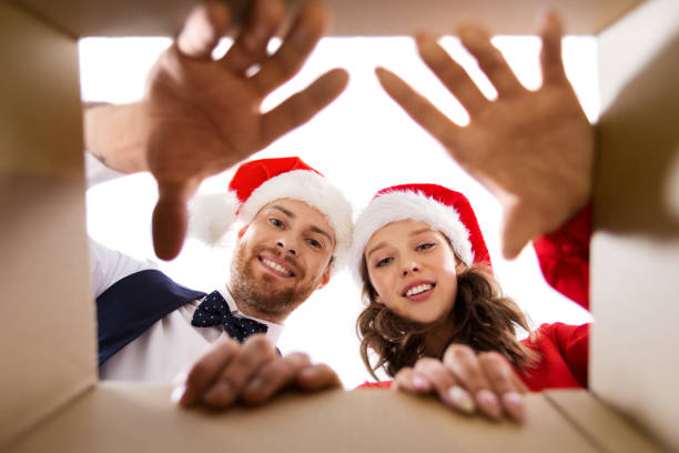 istock happy couple opening christmas gift box 1281821465