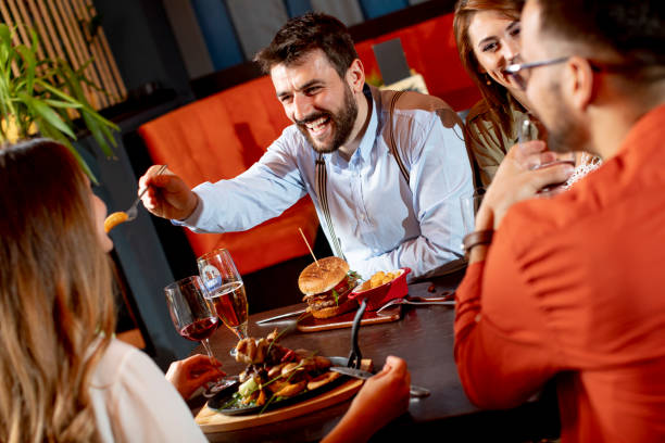 istock Young people having dinner in the restaurant 1281824960