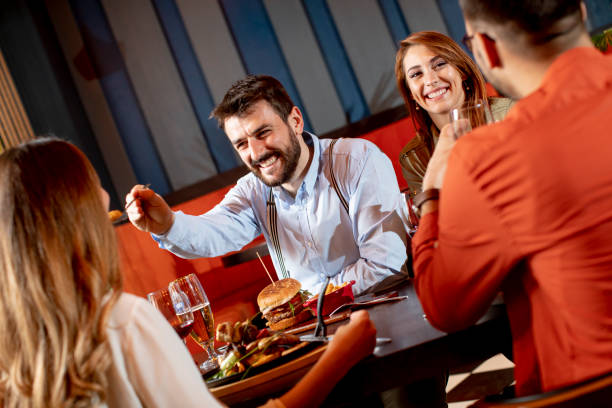 istock Young people having dinner in the restaurant 1281824969