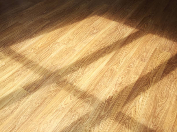 istock Reflection of sunlight through a window on a parquet wooden floor 1281829675