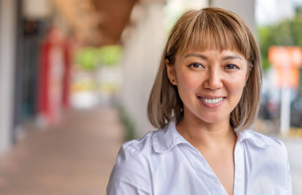 istock Portrait of Smiling White Collar Female 1281835321
