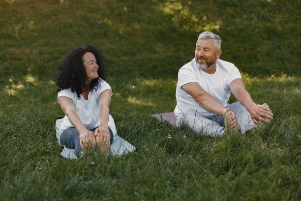 istock Happy elderly senior couple doing yoga 1281835471