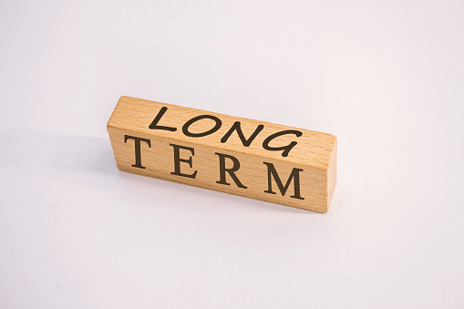 Long Term Concept on Wooden cube block long term, Business investment concept
