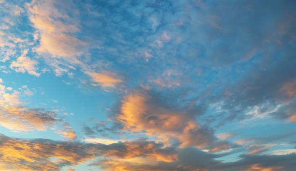istock Beautiful colorful bright sunset sky with orange clouds. Nature sky background. 1281840875