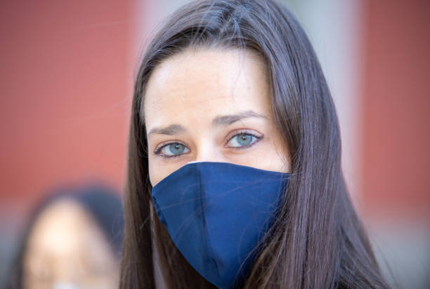 istock Charming woman in mask in city 1281841209
