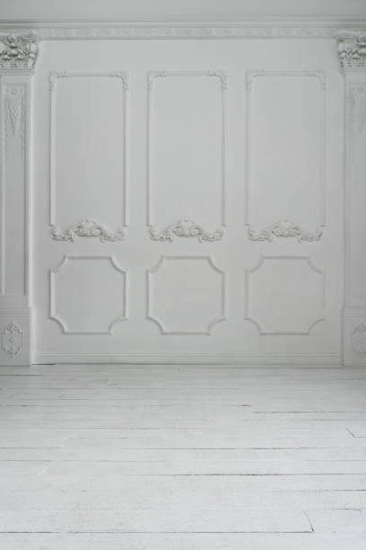 istock Empty white room with stucco decor on wall and wooden flor. Abstract background 1281842787
