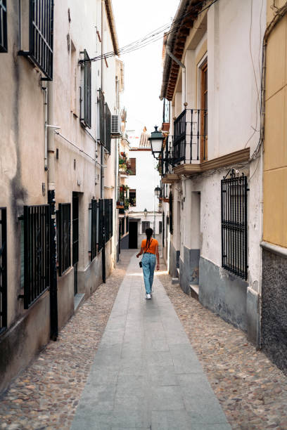 istock Unrecognizable tourist woman having a walk 1281843915