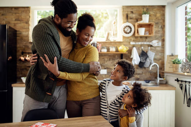 istock Embraced African American family talking in the kitchen. 1281844185